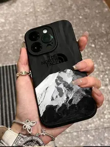 Чехол на Iphone 16 Pro / черный, The North face, снежные горы / С защитой камеры